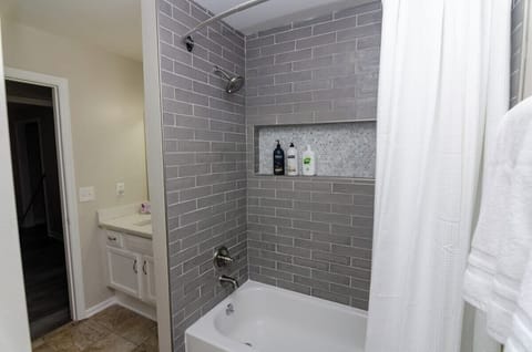 Combined shower/tub, hair dryer, towels, soap