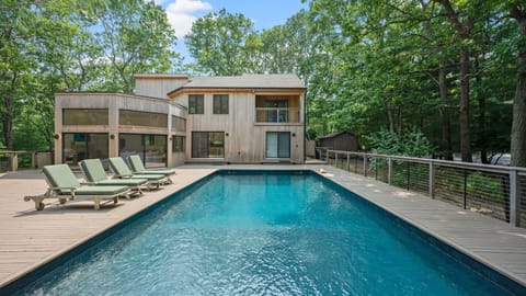 A heated pool, sun loungers