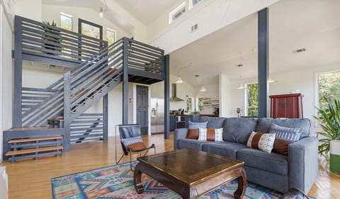 Living room with gorgeous windows, smart tv, and sleeper sofa