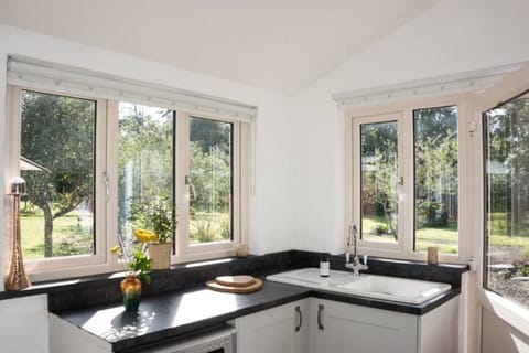 The door from the kitchen leads to your parking and lane access.