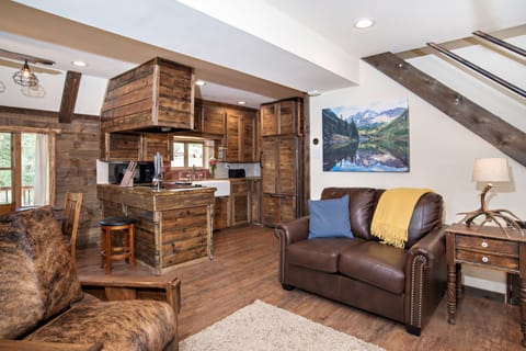 Living room looking into kitchen and dining area