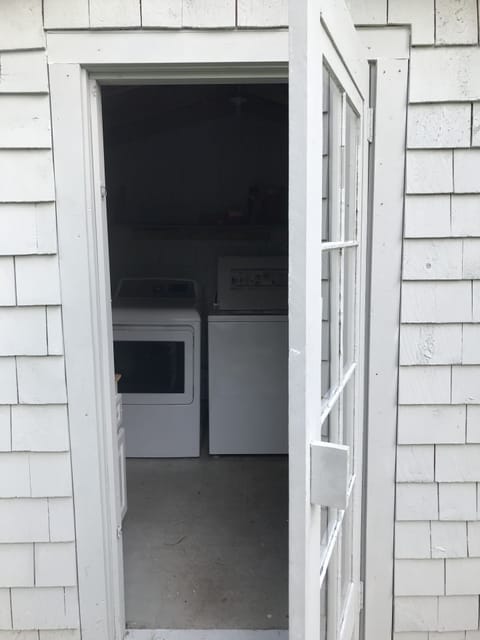 Washer and dryer on the south side of the house. 
