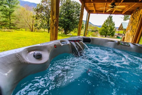 Enjoy the new hot tub on the lower level deck and sneak some mountain views.