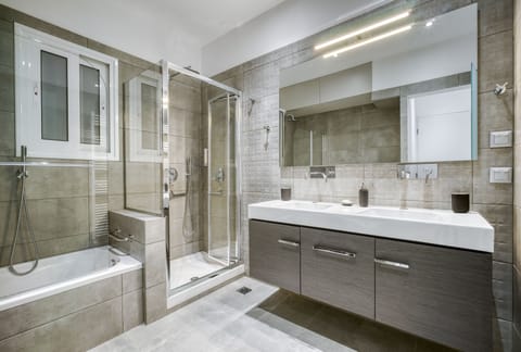 Combined shower/tub, hair dryer, towels, soap