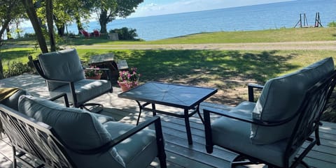 Day and night views of Lake Erie and steps to the beach.