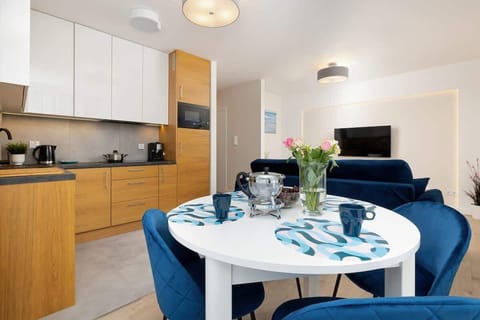 Large table with chairs for eating communal meals. 