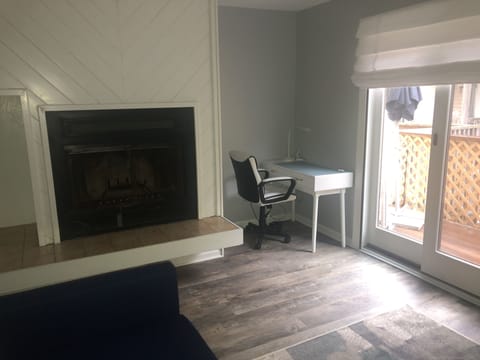 Fireplace and work station in living room.