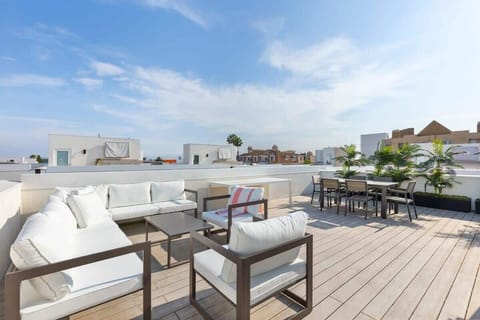 Rooftop views with plush outdoor seating and dining space