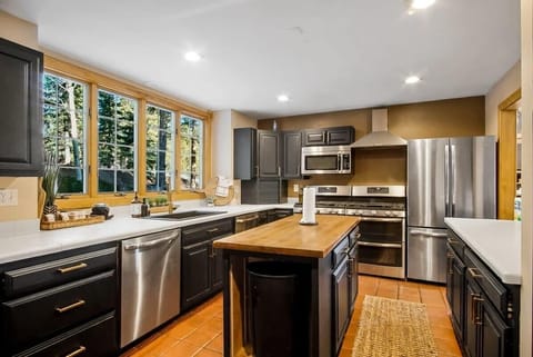 Fully-equipped kitchen with top-of-the-line stainless steel appliances and a spacious center island