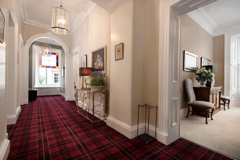 The Linen House - impressive first floor hallway with grand proportions and stunning architrave mouldings and cornicing
