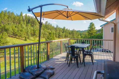 Deck with table and chairs (Note table has been updated to seat 8 guests)