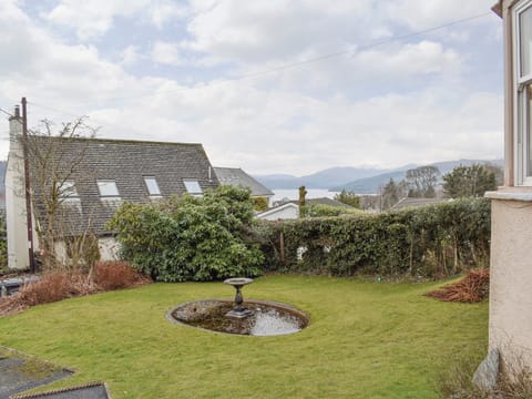 Lawned front garden with extensive views over the lake to the mountains beyond | 1 Brantfield House, near Bowness on Windermere