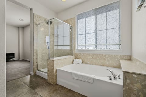 Combined shower/tub, hair dryer, towels, soap