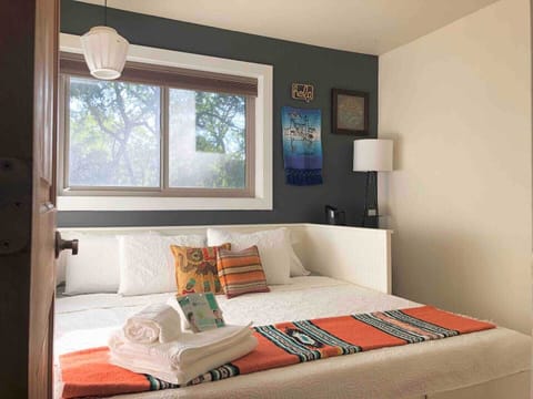 Guess bedroom with bed extended to its queen configuration.