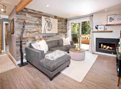 Cozy open concept living space with remote controlled gas fire place. 