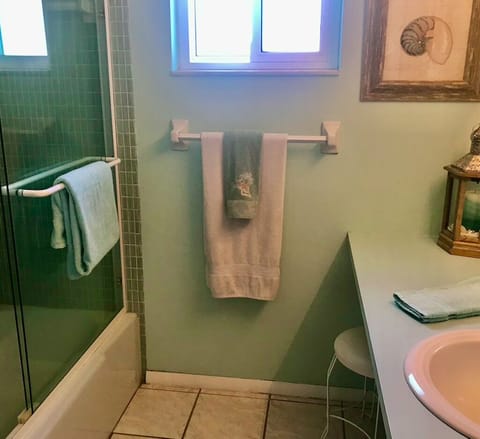 Combined shower/tub, hair dryer, towels, toilet paper