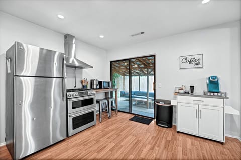 kitchen view with sliding glass door and coffee bar