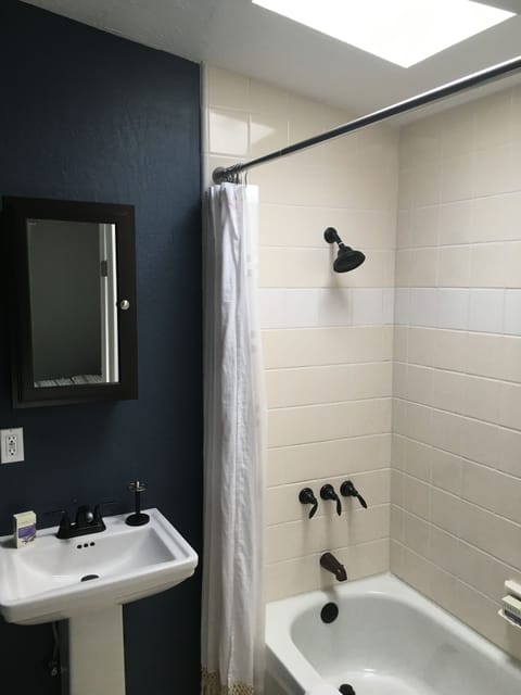 Combined shower/tub, hair dryer, towels, soap