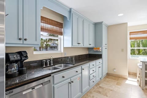 Enjoy cooking in a bright, fully stocked kitchen featuring stainless steel appliances, granite countertops, and breathtaking canal views right from the breakfast bar.