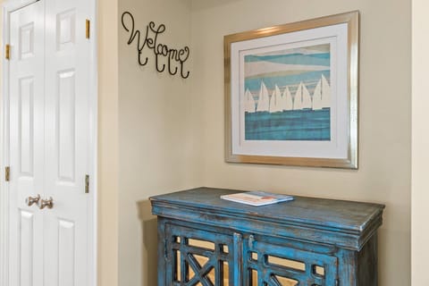 The spacious entryway offers a charming first look at this stunning Holiday Isle home — blending relaxed coastal style with a hint of luxury and comfort from the moment you arrive.