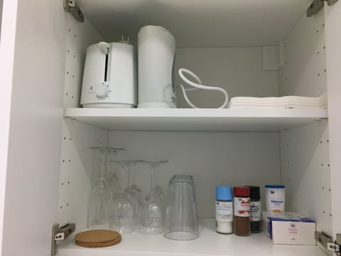 Fridge, coffee/tea maker, toaster, cookware/dishes/utensils