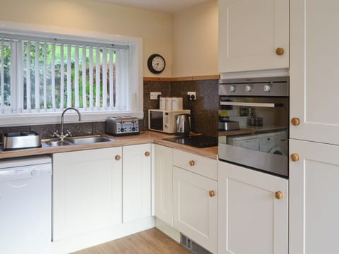 Well-equipped fitted kitchen with built-in oven and hob | Elm Bank, Lochcarron, near Wester Ross