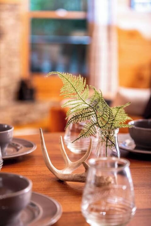 A rustic dining table centerpiece with natural touches.
