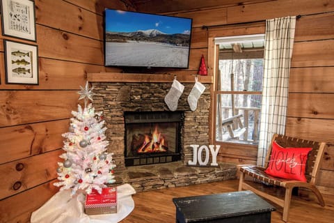 Festive decorations by the warm fireplace.