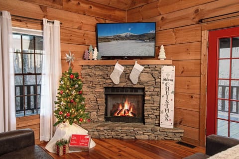 The festive living room with its stone fireplace.