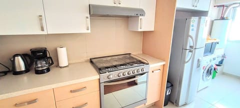 The laundry room is conveniently located next to the kitchen and is equipped with a washer/dryer for your laundry needs, allowing you to freshen up your clothes during your stay.