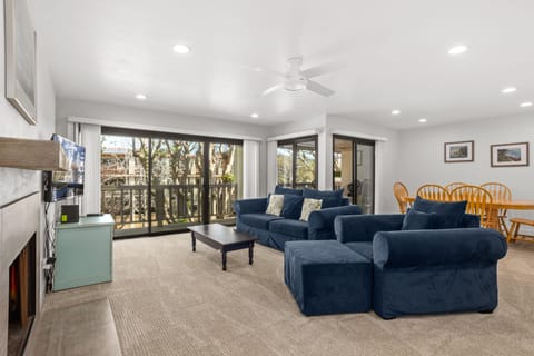 Super clean living room opens to a bright patio in Seascape Sur