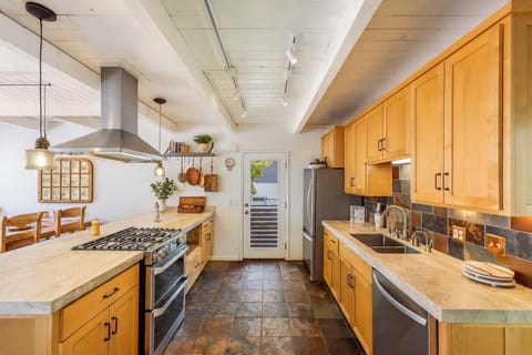 Well stocked kitchen that flows easily into breakfast nook, living room, den, or deck.