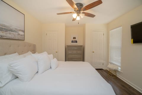The second bedroom features a luxury queen bed