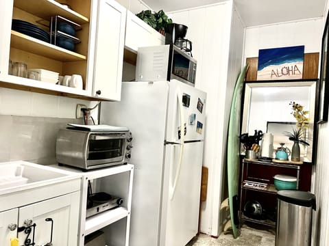 Fridge, microwave, stovetop, coffee/tea maker