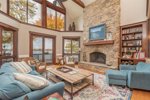 2 story cathedral living room with stone fireplace