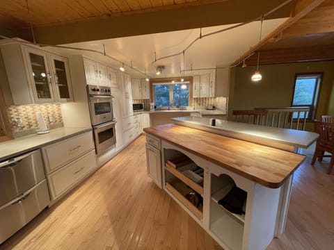 Stocked kitchen with silverware and basic necessities 