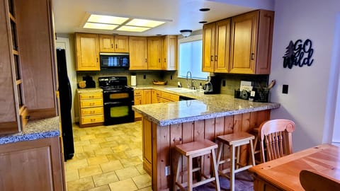 Well-stocked Kitchen w/ microwave, double oven, new dishwasher