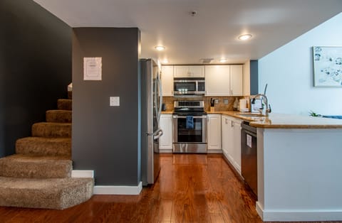Fully Stocked Kitchen with Stainless Steel Appliances