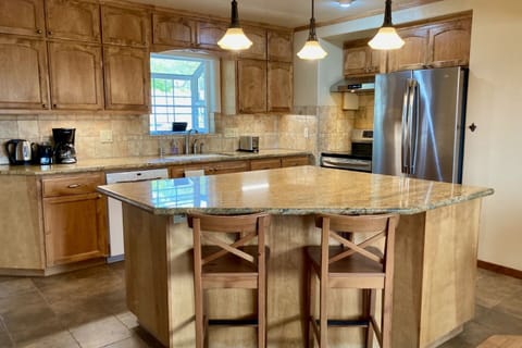 Vast granite countertops provide space for prepping meals or planning excursions