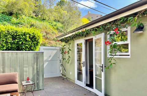 French doors inviting the ocean breeze and sounds of soothing fountain.