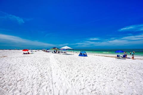 On the beach, sun loungers, beach towels