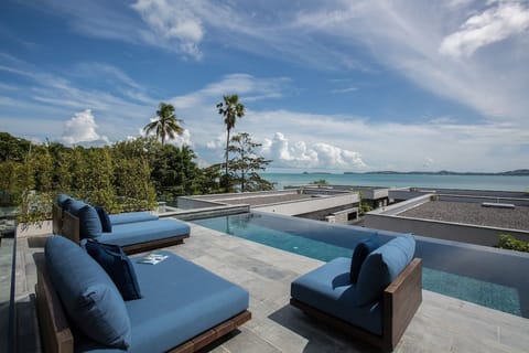 An infinity pool, sun loungers