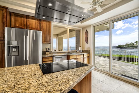 Stainless steel appliances and granite countertops elevate every cooking experience.