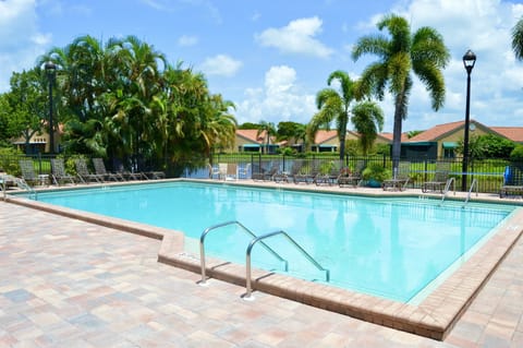 A heated pool, pool umbrellas