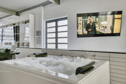 Bathtub, jetted tub, hair dryer, towels