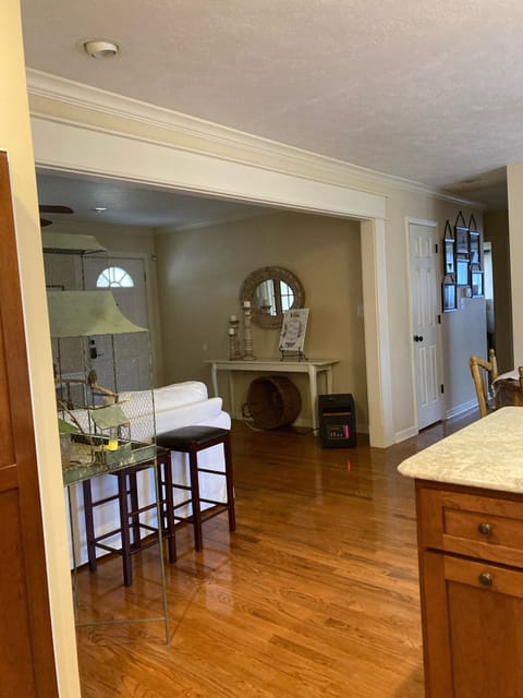 Looking down the hall and into the front room from the kitchen 