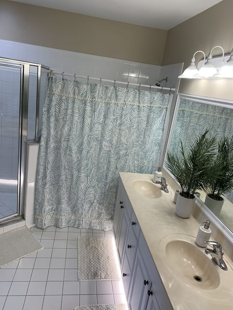 Combined shower/tub, hair dryer, towels, soap