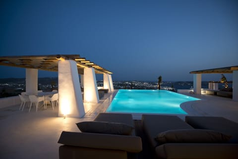 An infinity pool, sun loungers