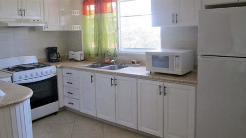 Fridge, cookware/dishes/utensils, dining tables