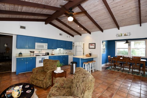 The front living room opens to kitchen and dining room.